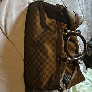 Vintage, authentic Louis on wheels. Barely used